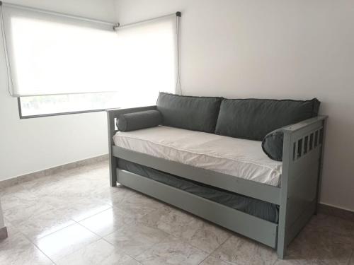 En eller flere senge i et værelse på Departamento Privado y Equipado en Planta Alta