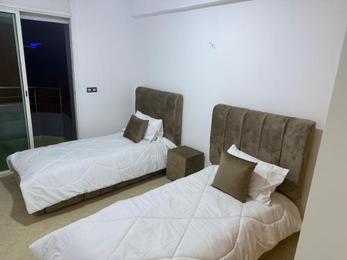 Postel nebo postele na pokoji v ubytování Baya Residentie