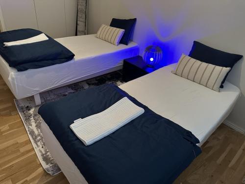 Postel nebo postele na pokoji v ubytování Tapulikaupunki Apartment Helsinki