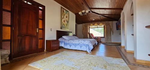 En eller flere senge i et værelse på Casa Colonia Duitama Tu refugio en Boyacá