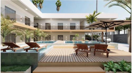 Villa mit einem Pool mit Stühlen und einem Tisch in der Unterkunft Flat em Barra Grande com piscina in Barra Grande