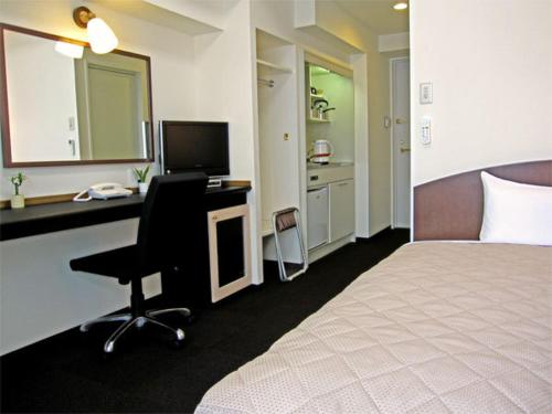 TV a/nebo společenská místnost v ubytování Tachikawa Urban Hotel