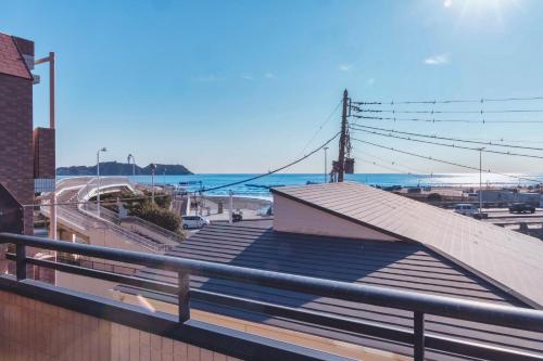 a roof of a building with a view of the ocean at Entire Villa, 2-Min to Beach, near Enoshima Island in Fujisawa