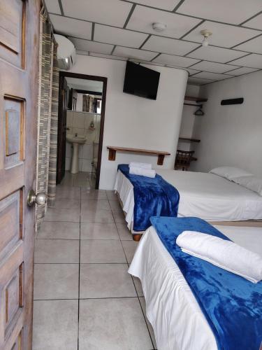 Krevet ili kreveti u jedinici u okviru objekta Hostal Darwin