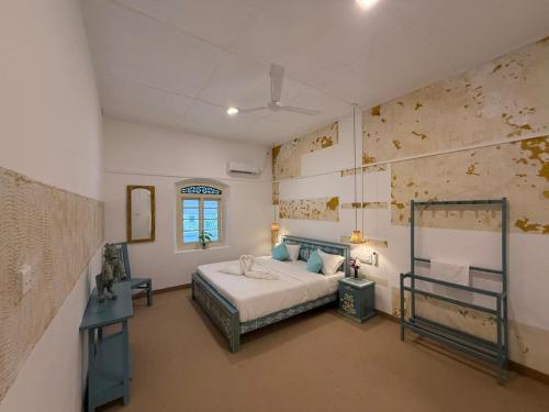 En eller flere senge i et værelse på 1929 Sudu Colonial House