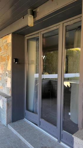 a sliding glass door on the side of a house at Charmant studio avec terrasse in Aiguebelle