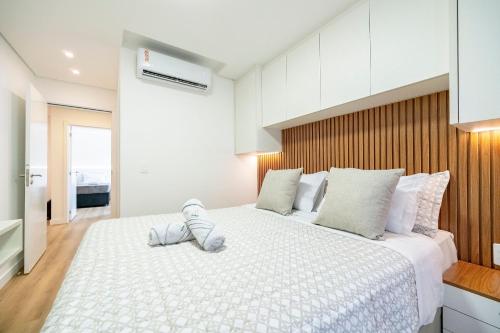 En eller flere senge i et værelse på Riviera Vista Mar 2 Qt e Piscina by Achei Camboriú