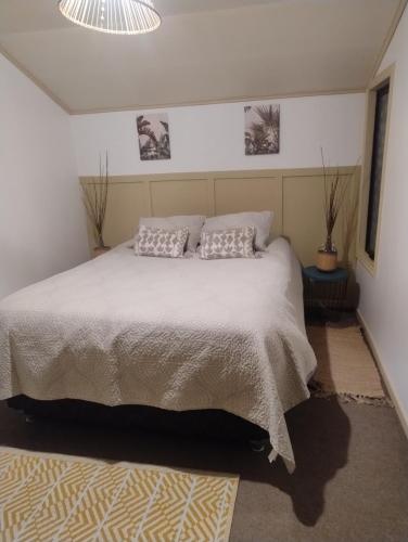 Ένα ή περισσότερα κρεβάτια σε δωμάτιο στο Temporada de verano Puerto Varas