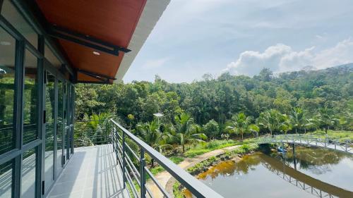 a balcony with a view of a river and a bridge at Thiên Vy Homestay in Phu Quoc