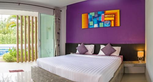 Postel nebo postele na pokoji v ubytování The Fong Krabi resort