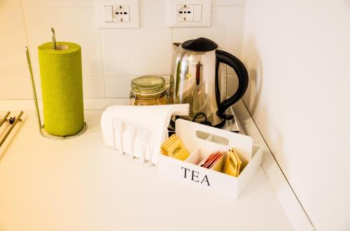 a tea cart on a kitchen counter with a kettle at CoreHome in Albano Laziale