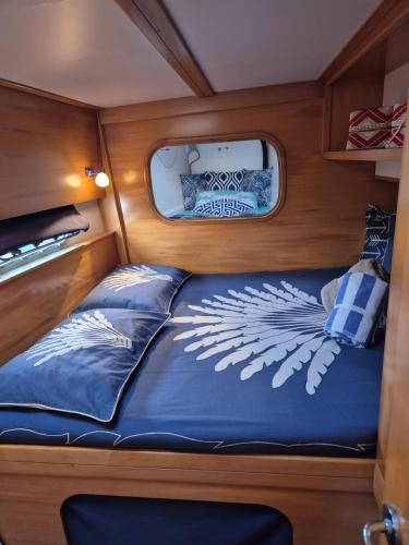 a bed in the back of a motor boat at Your Private Boat - Magic Bora Bora-FR Polynesia in Bora Bora