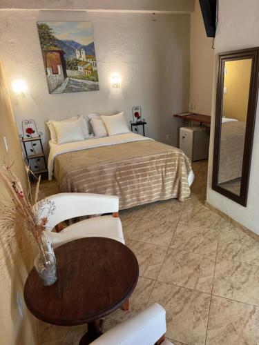 Ένα ή περισσότερα κρεβάτια σε δωμάτιο στο Pousada Belvedere da Serra