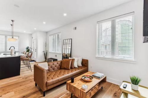 a living room with a couch and a table at Modern 3BR Walk to Museums in Philadelphia