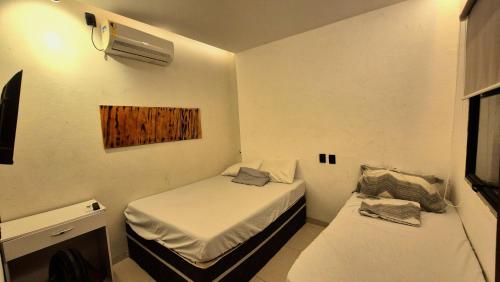 En eller flere senge i et værelse på Casa de Praia com Piscina em Maceió - Ipioca - Sauaçuhy