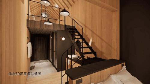 a spiral staircase in a room with a bed at Zu Sin Garden B&B in Renai