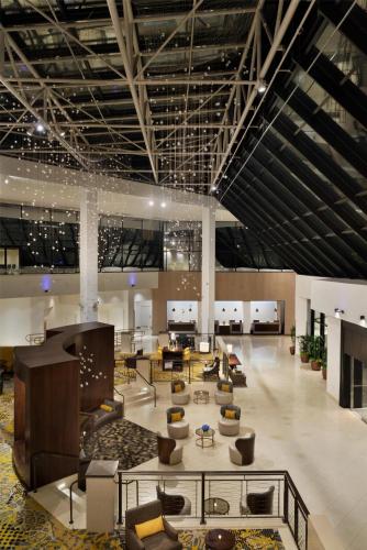 a lobby with couches and tables in a building at DoubleTree by Hilton Stamford in Stamford