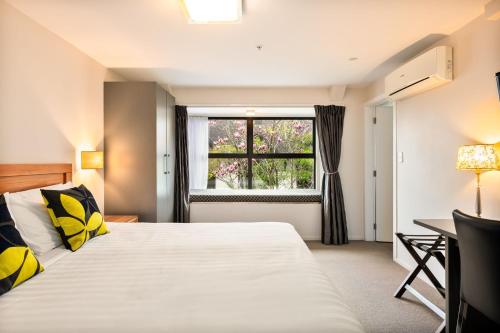 Ένα ή περισσότερα κρεβάτια σε δωμάτιο στο Alexander Inn