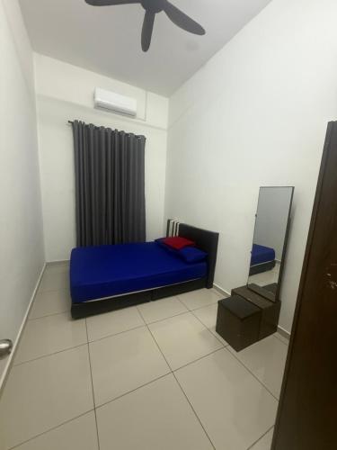 En eller flere senge i et værelse på Banglo Jasin Perdana