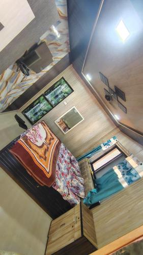 an overhead view of a bedroom with a bed at Kparth cottage in Matheran