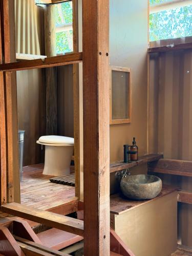 a bathroom with a sink in a room at The Village Eco Stay Byron Bay in Byron Bay