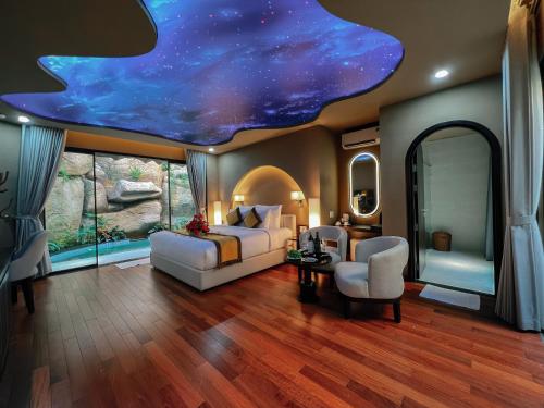 a bedroom with a bed and a star ceiling at Lamori Resort & Spa, Thanh Hoá in Thanh Hóa