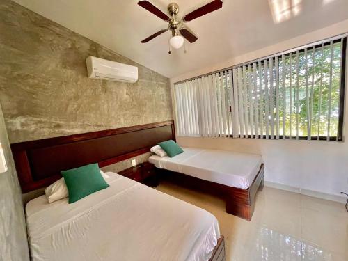 Postel nebo postele na pokoji v ubytování Villas Náutico Chairel