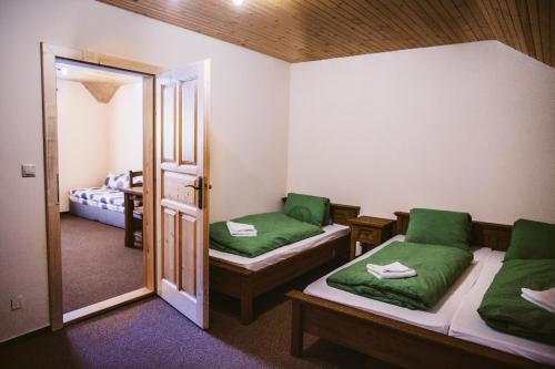 Postel nebo postele na pokoji v ubytování Apartmány Zuzka