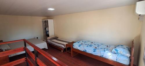 a room with two bunk beds and a bed at La Palmera in Chajarí
