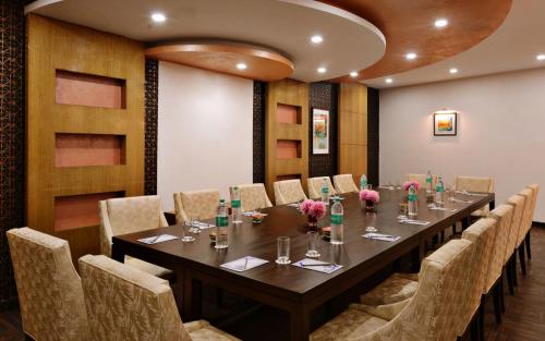 a conference room with a long table and chairs at JK Clarks Exotica in Dalhousie