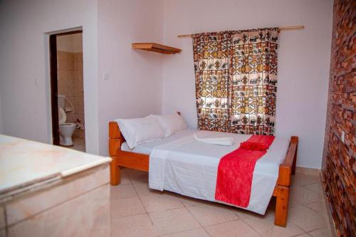 Postel nebo postele na pokoji v ubytování Brightstar Apartments Diani