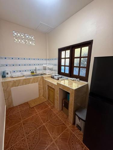 a large bathroom with a sink and a counter at Anawin Bungalows in Ao Nang Beach