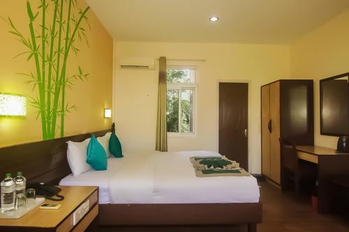 En eller flere senge i et værelse på Center Park Resort Pvt.Ltd