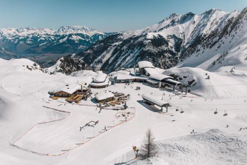 an aerial view of a ski resort in the snow at Ski Dome Apartments-Apartment VIVA & Heaven Holiday Chalet in Kaprun