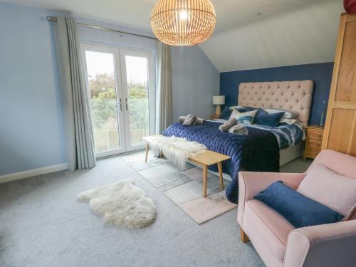 Postel nebo postele na pokoji v ubytování 11 Parc Delfryn