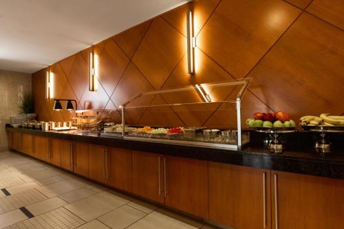 a buffet line in a restaurant with fruits and vegetables at Hyatt House Seattle Bellevue in Bellevue