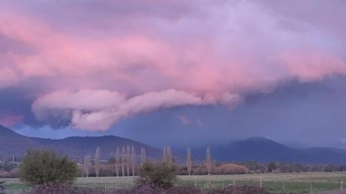 a group of clouds in the sky over a field at Little Birdy in Tawonga