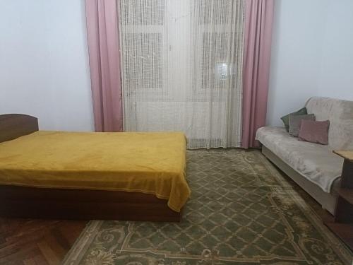 En eller flere senge i et værelse på Casa Roxana