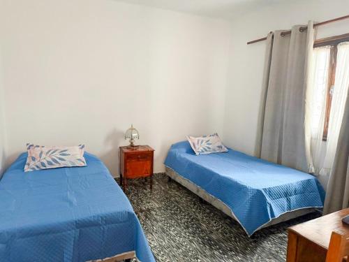 En eller flere senge i et værelse på CASA HORTENSIA