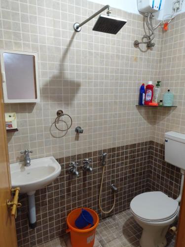 a bathroom with a toilet and a sink at Agapi Homestay in Cochin
