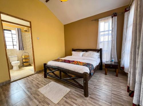 En eller flere senge i et værelse på KEDOVO Cottages