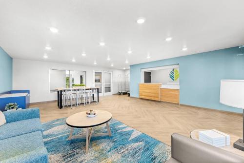 a living room with a couch and a table at WoodSpring Suites Oak Ridge Knoxville in Oak Ridge
