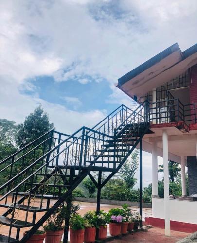 En balkon eller terrasse på COFFEE ESTATE STAY COORg