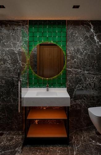 a bathroom with a sink and a mirror at Castellion Hotels Galata in Istanbul