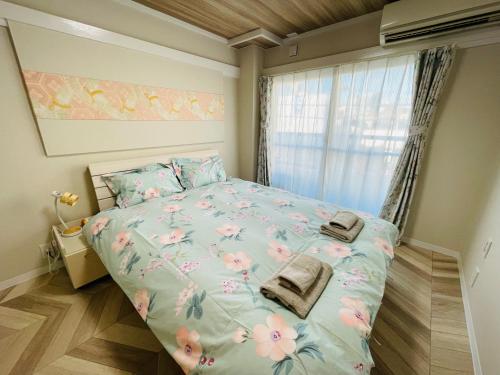 Postel nebo postele na pokoji v ubytování 横浜黄金町民泊