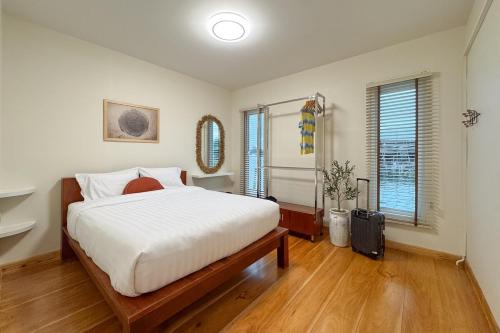 Giường trong phòng chung tại Water villa rayong