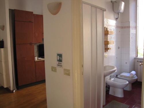 a bathroom with a toilet and a sink at Casa Castelbolognese in Rome