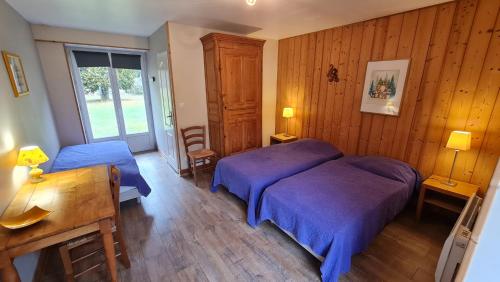 Postel nebo postele na pokoji v ubytování DOMAINE DES GRAVIERS