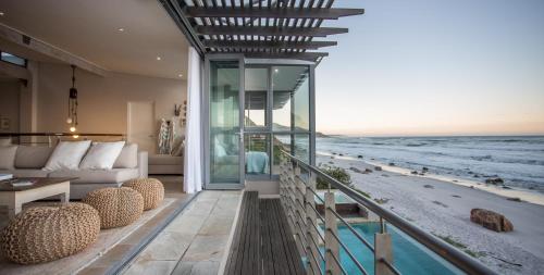 a living room with a view of the ocean at Villa Misty Cliffs in Scarborough