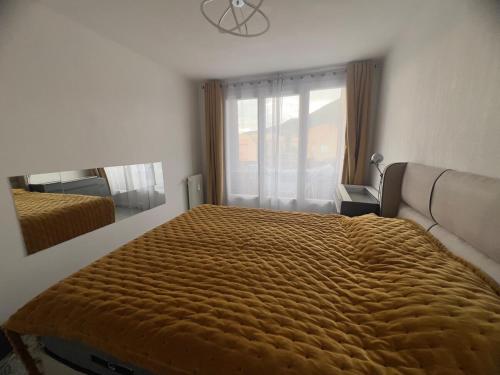 Giường trong phòng chung tại CozyT2 44m2 Quality bed, well-equipped kitchen